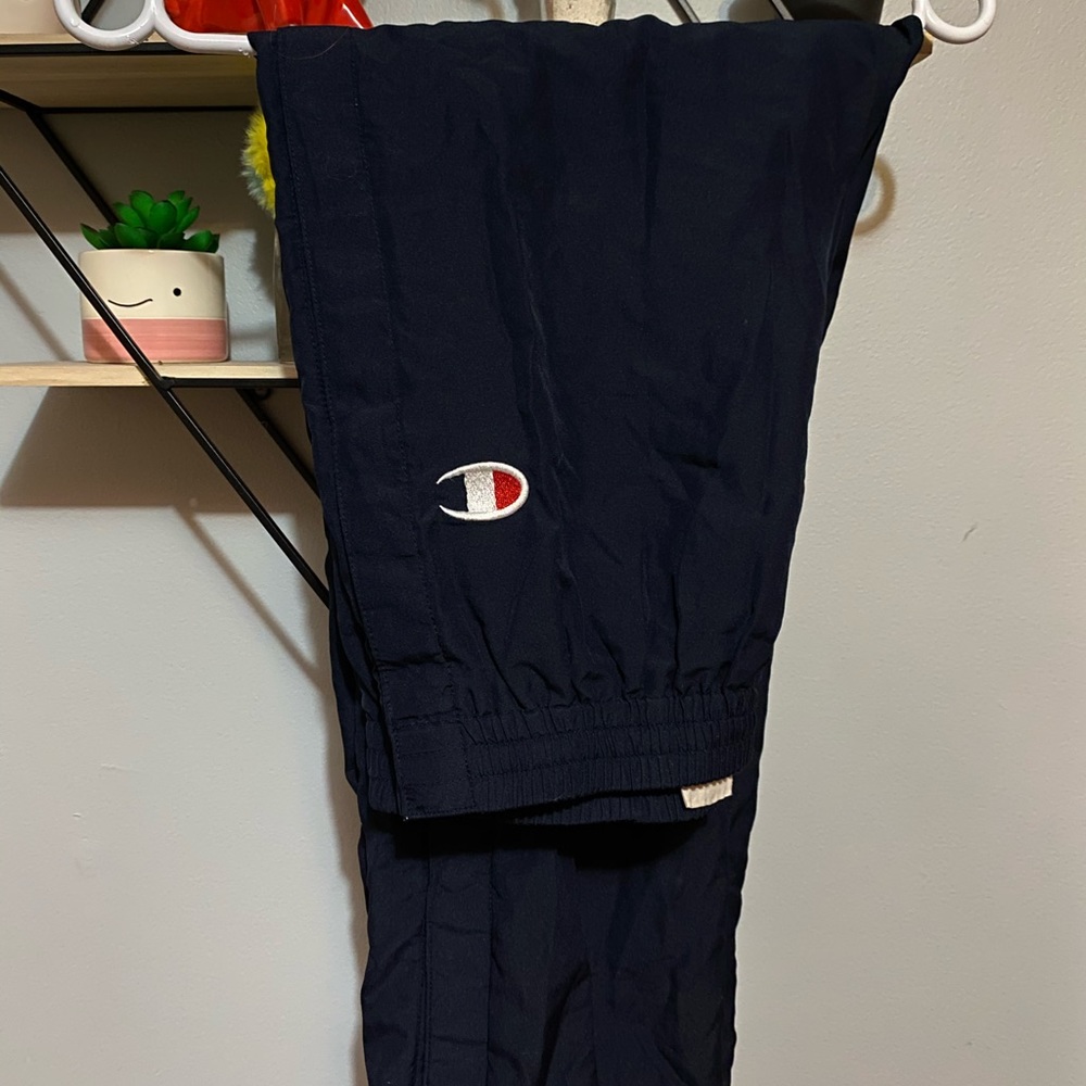 Champion track pants can be open by the sides/legs